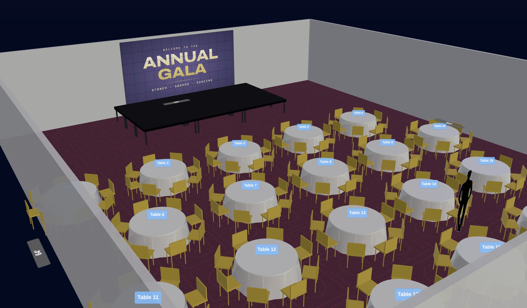 A ballroom in Forectra: round tables with ivory linens and gold chairs facing a stage and an LED screen